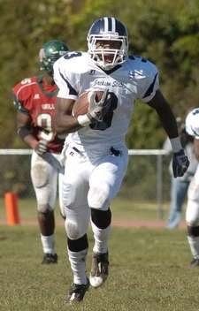 Running back breaking away with the ball