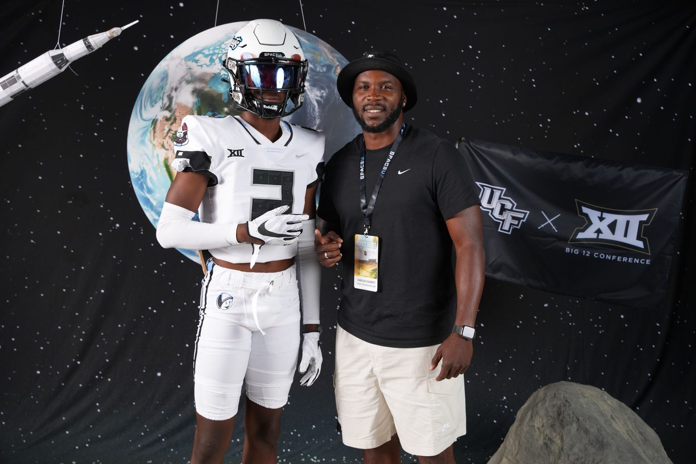 Coach Carlos Everett with a football recruit at a UCF visit